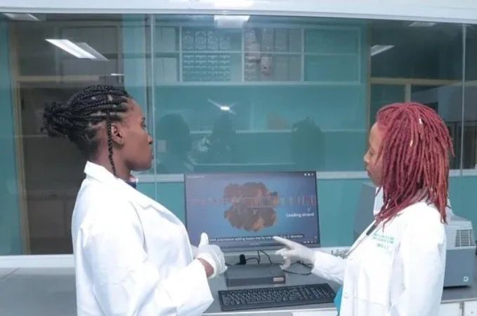 MELL laboratory professionals reviewing molecular laboratory work