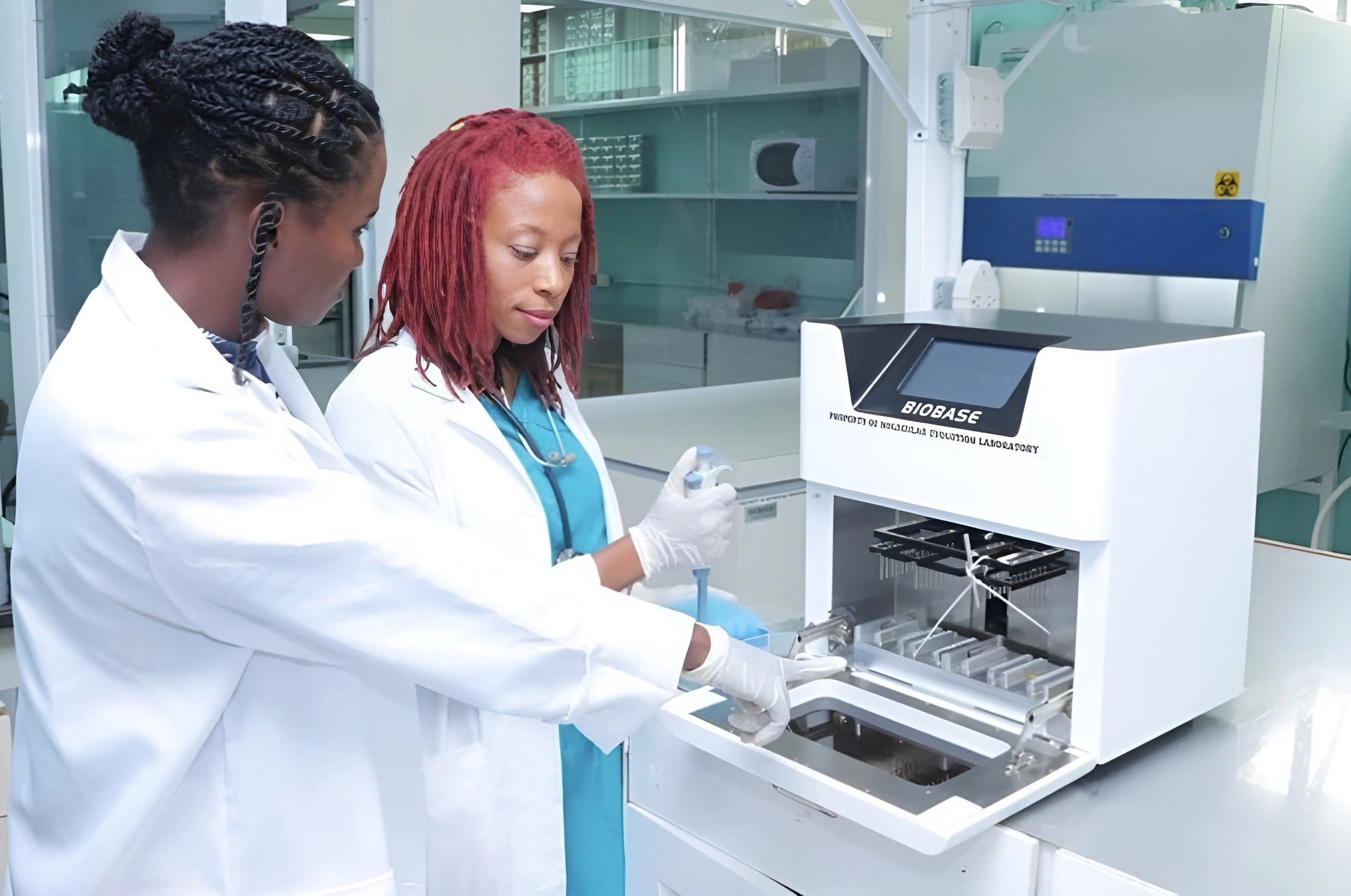 MELL laboratory professionals operating molecular testing equipment
